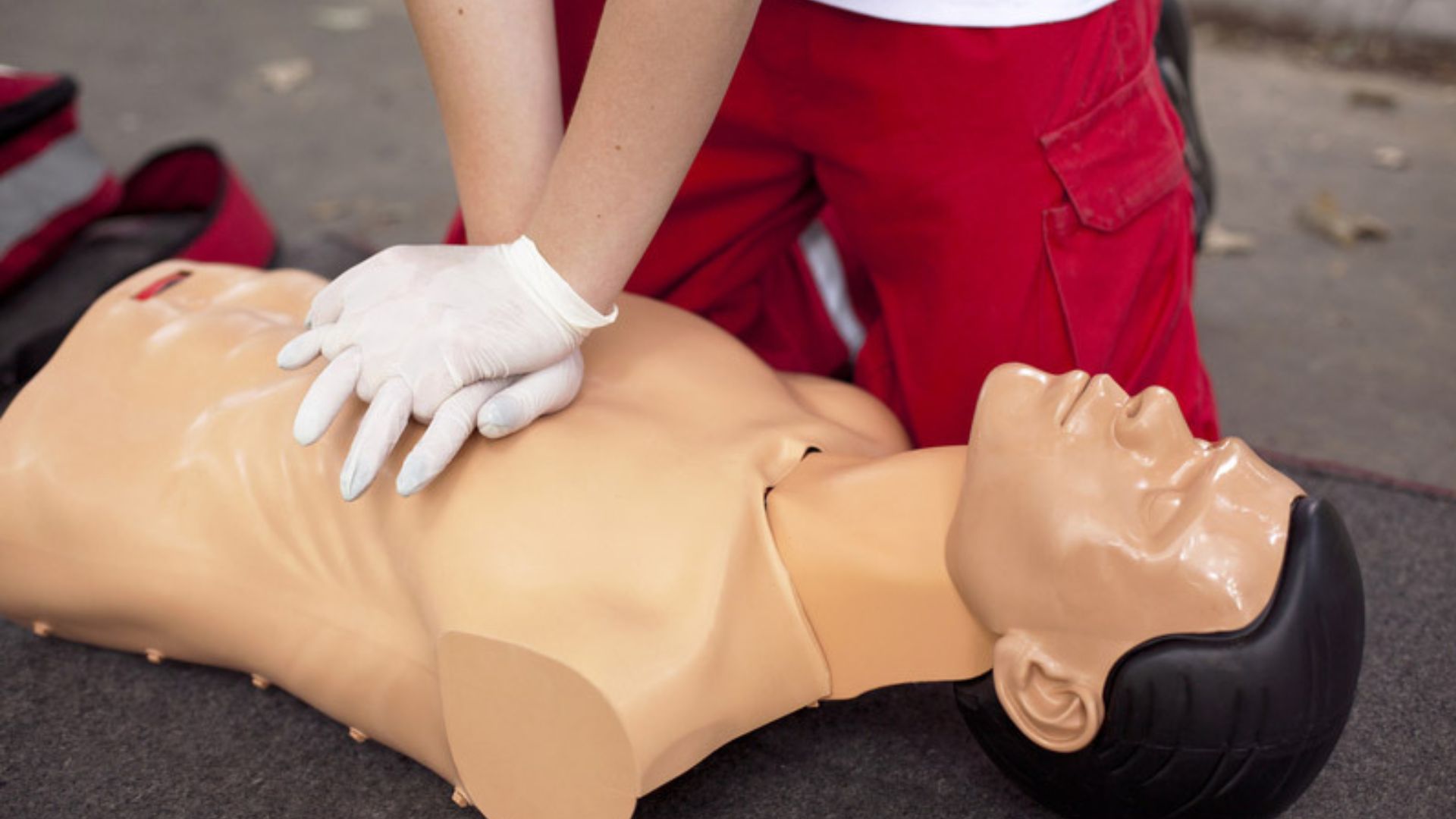 CPR chest compression demonstrated on manikin