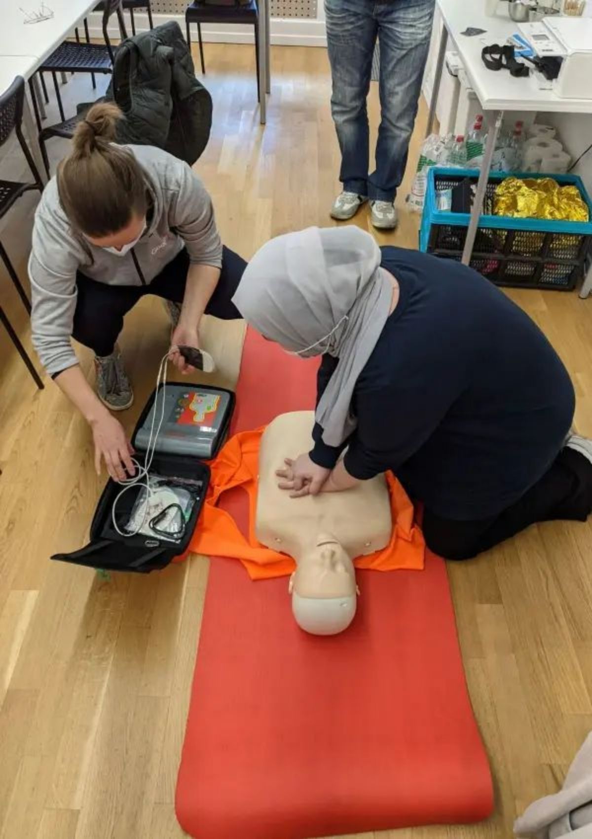 CPR on dummy Family and Friends CPR Class Charlotte